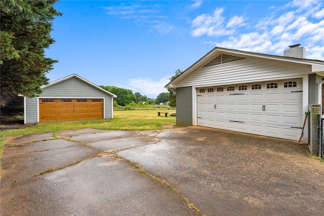 4508 Old Williamston Road Belton, SC 29627 - Photo 27 of 47 The property features multiple spacious garages, offering ample storage and parking solutions.