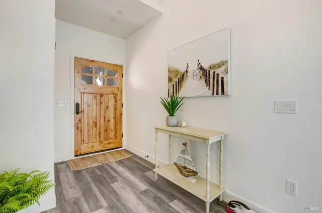 a view of room with window and wooden floor