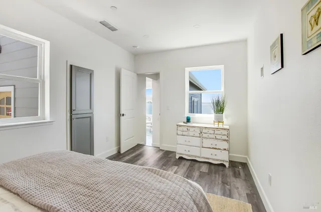 a bedroom with a bed and a dresser