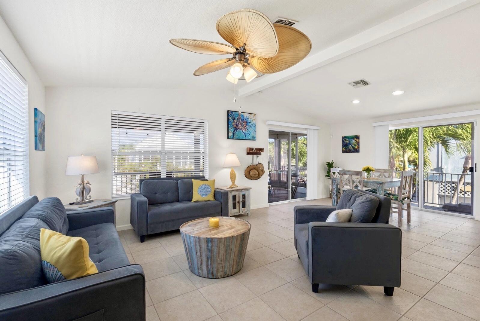 157 Mars Lane Key West, FL 33040 - Photo 8 of 41 a living room with fireplace furniture and a large window