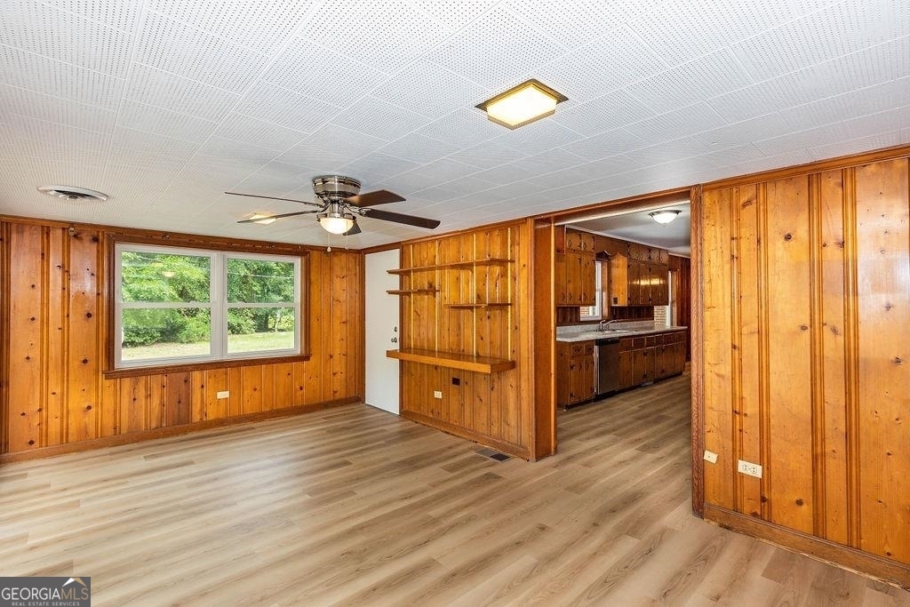 405 Springfield Avenue Guyton, GA 31312 - Photo 13 of 39 a view of a kitchen with wooden floor and a window
