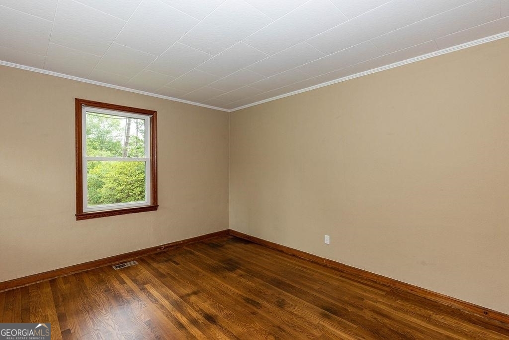 405 Springfield Avenue Guyton, GA 31312 - Photo 19 of 39 an empty room with a window