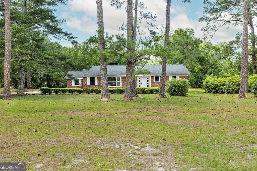 405 Springfield Avenue Guyton, GA 31312 - Photo 36 of 39 a front view of a house with a yard