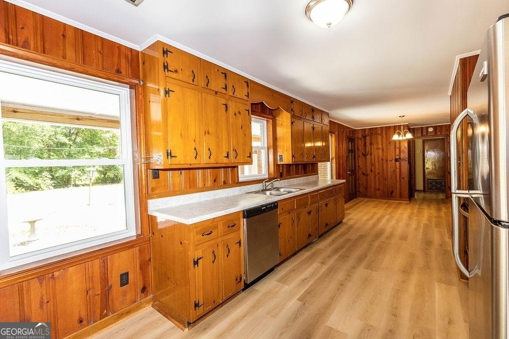 405 Springfield Avenue Guyton, GA 31312 - Photo 7 of 39 a large kitchen with stainless steel appliances a large counter top