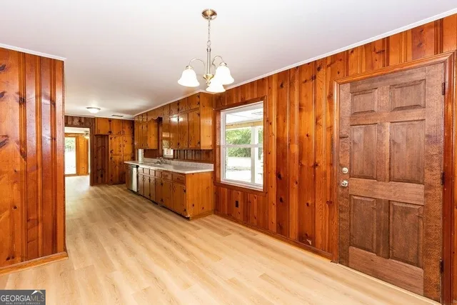 a view of a kitchen with a sink and cabinets