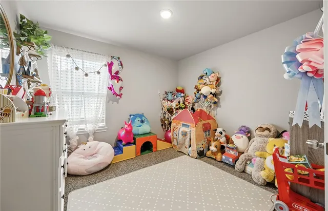 a bedroom with toys and a couch