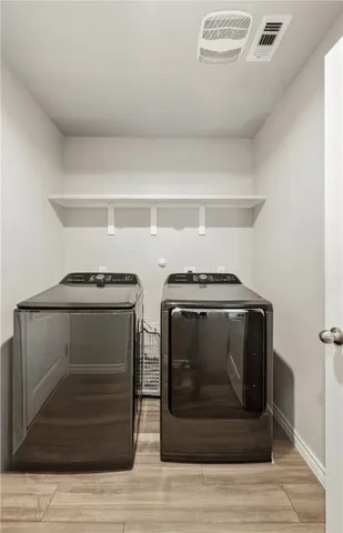 a utility room with washer and dryer