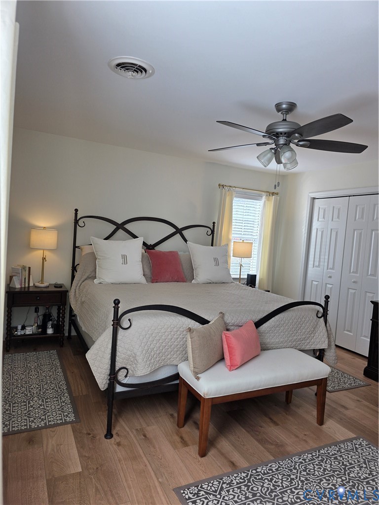 8511 Peaks Road Hanover, VA 23069 - Photo 33 of 48 a bedroom with a bed and a chandelier