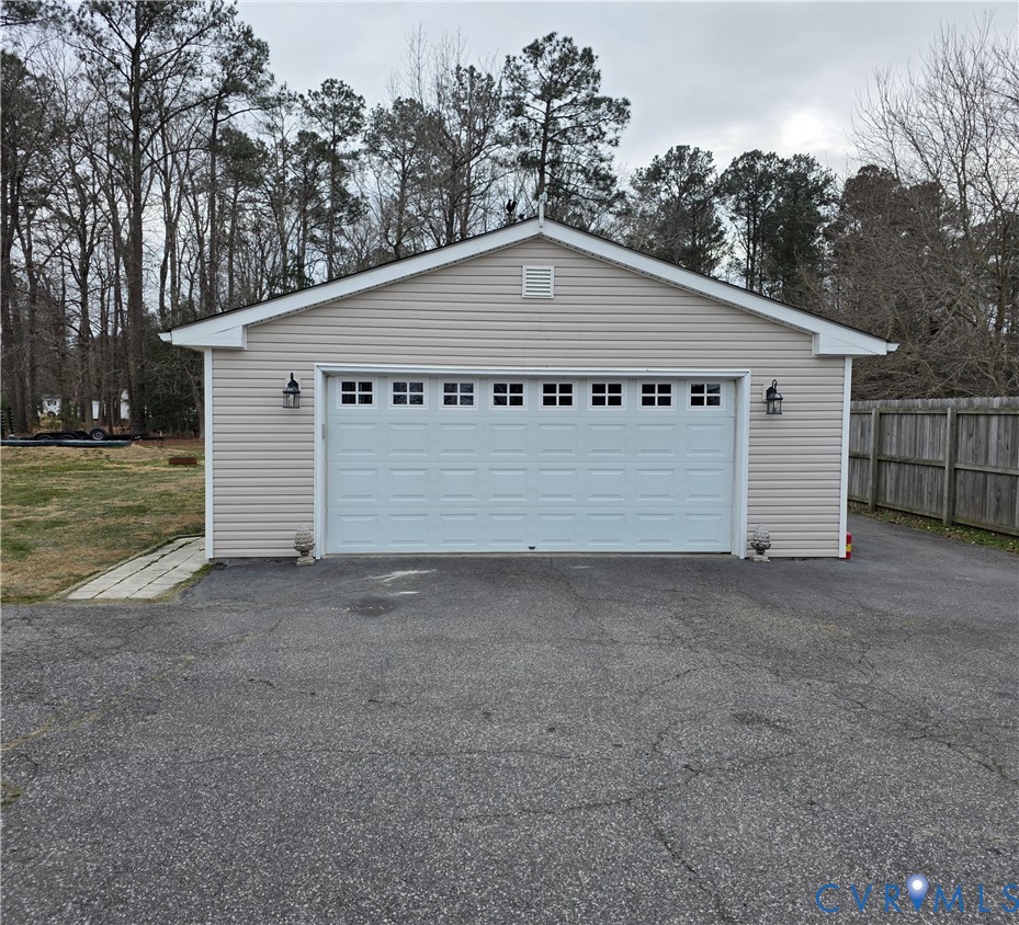 8511 Peaks Road Hanover, VA 23069 - Photo 7 of 48 a view of a house with a yard and garage