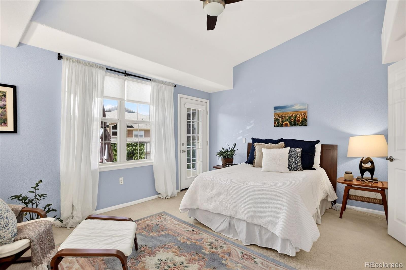 10715 Twenty Mile Road, Unit 202 Parker, CO 80134 - Photo 15 of 26 a bedroom with a bed and window