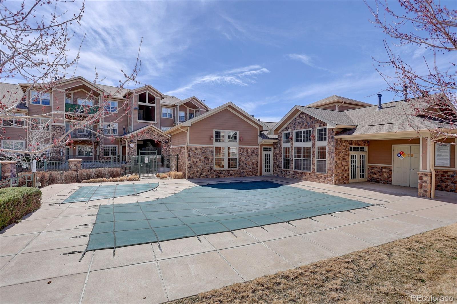 10715 Twenty Mile Road, Unit 202 Parker, CO 80134 - Photo 25 of 26 a view of house with yard and outdoor space