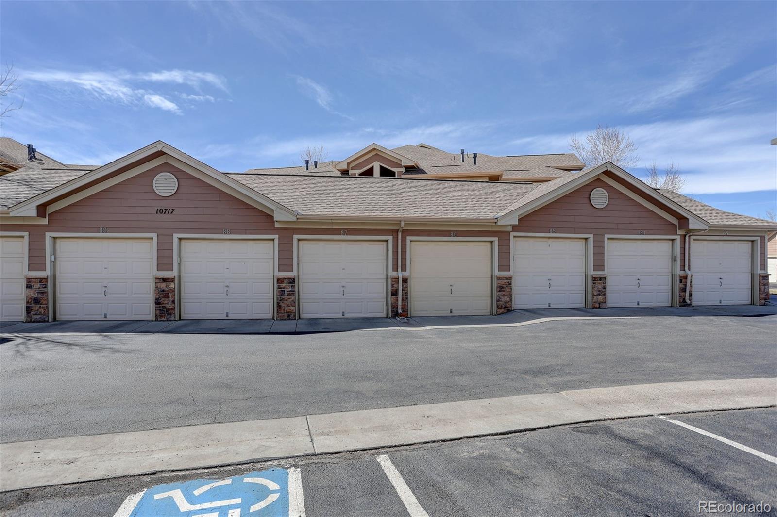 10715 Twenty Mile Road, Unit 202 Parker, CO 80134 - Photo 26 of 26 a front view of a house with a yard