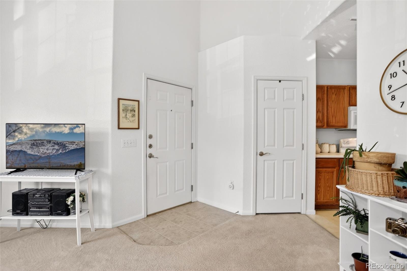 10715 Twenty Mile Road, Unit 202 Parker, CO 80134 - Photo 8 of 26 a view of kitchen and utility room