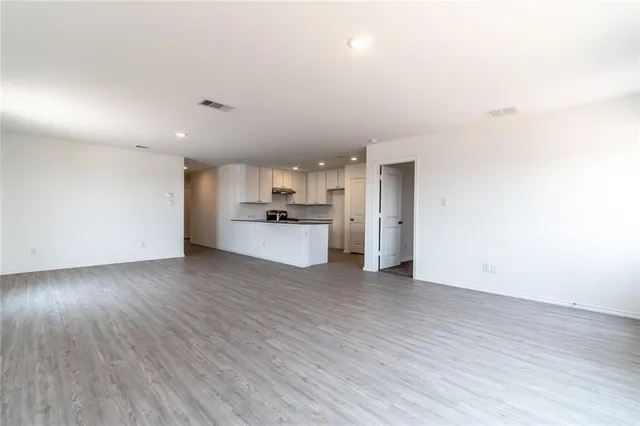 a view of a kitchen with a sink and a stove top oven