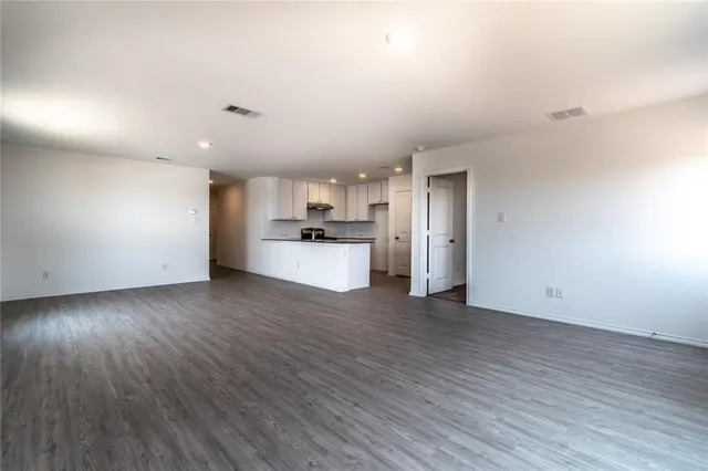 a view of a kitchen with a sink and a stove top oven