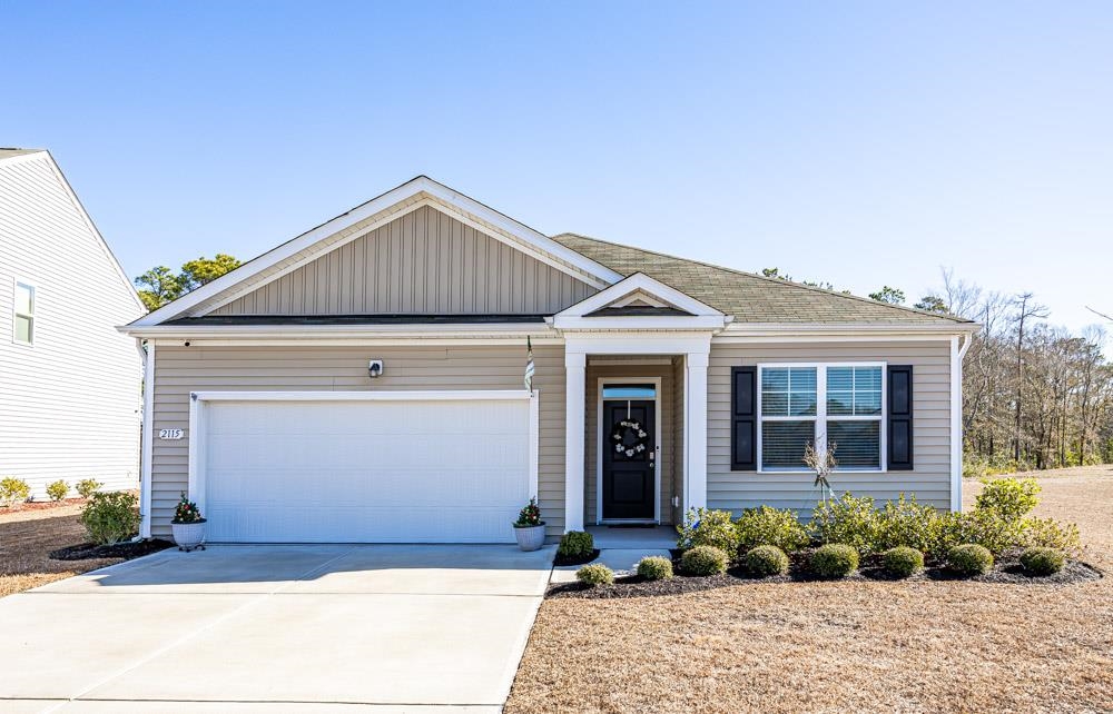 2115 Ridgedale Drive Conway, SC 29526 - Photo 1 of 38 View of front of home featuring concrete driveway, board and batten siding, and an attached garage