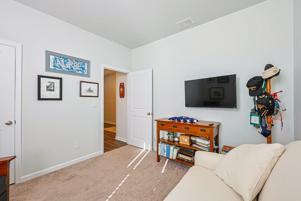 2115 Ridgedale Drive Conway, SC 29526 - Photo 17 of 38 Living room featuring carpet flooring and baseboards