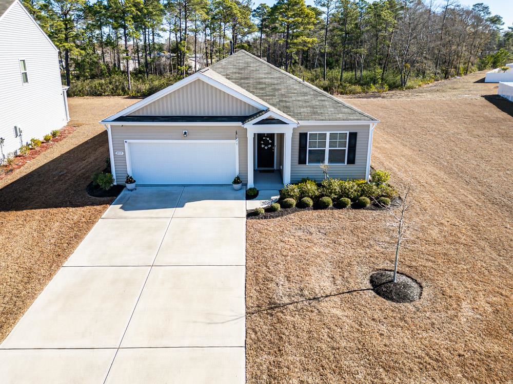2115 Ridgedale Drive Conway, SC 29526 - Photo 35 of 38 Single story home with concrete driveway, an attached garage, and a shingled roof