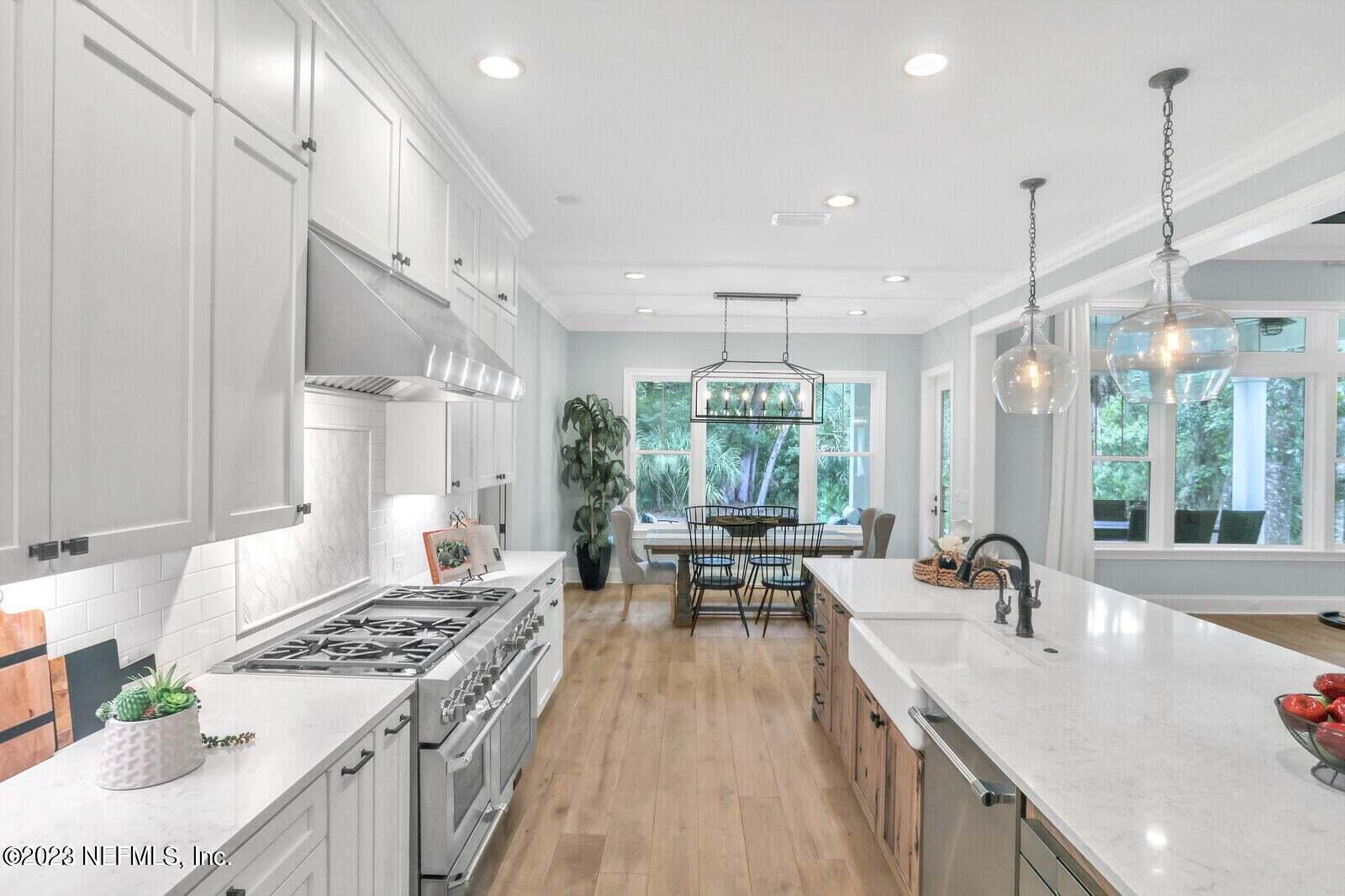 168 Hickory Hill Drive St. Augustine, FL 32095 - Photo 11 of 42 a kitchen with sink stove and chairs