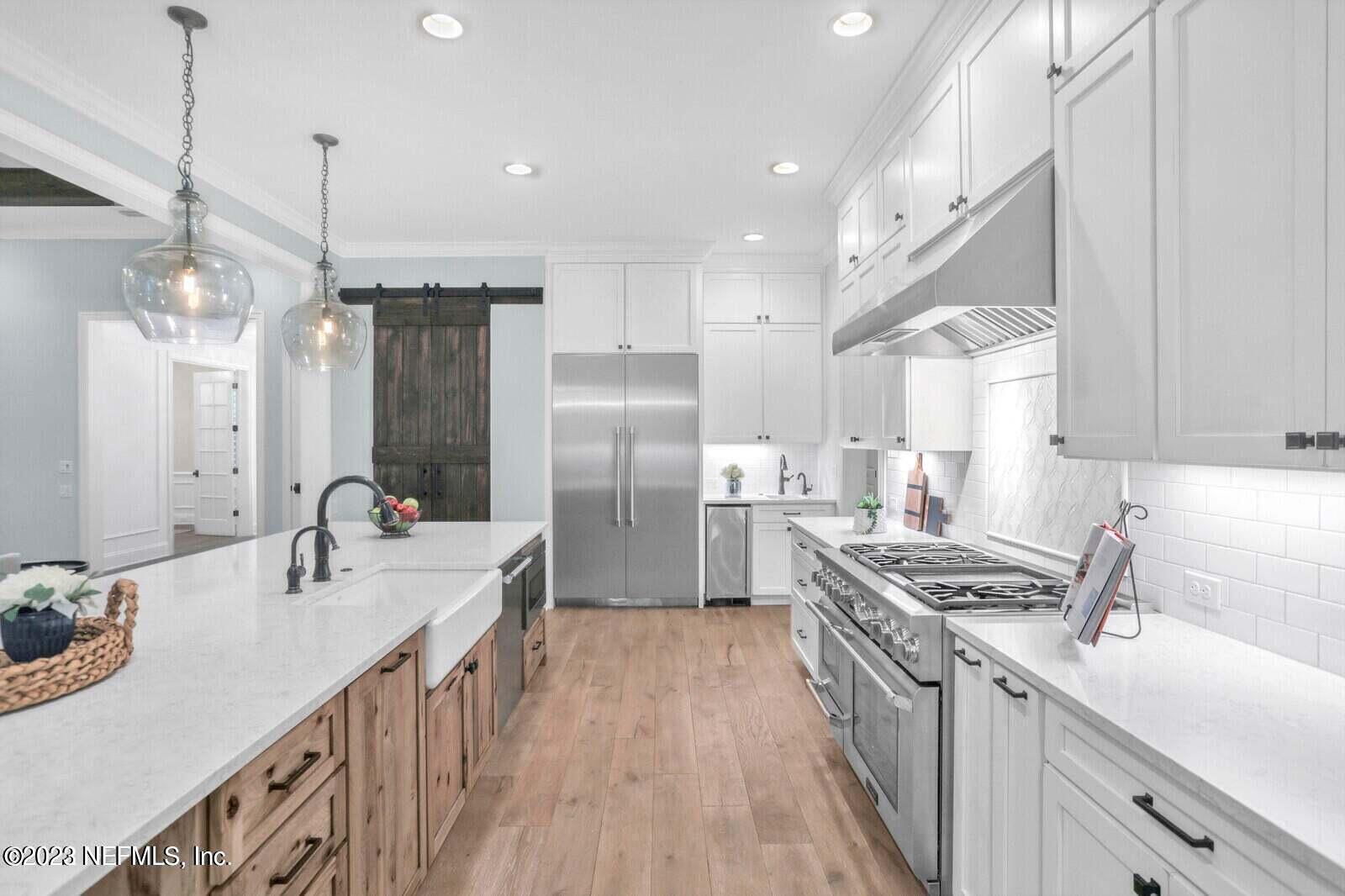 168 Hickory Hill Drive St. Augustine, FL 32095 - Photo 13 of 42 a kitchen with stainless steel appliances a sink stove and refrigerator