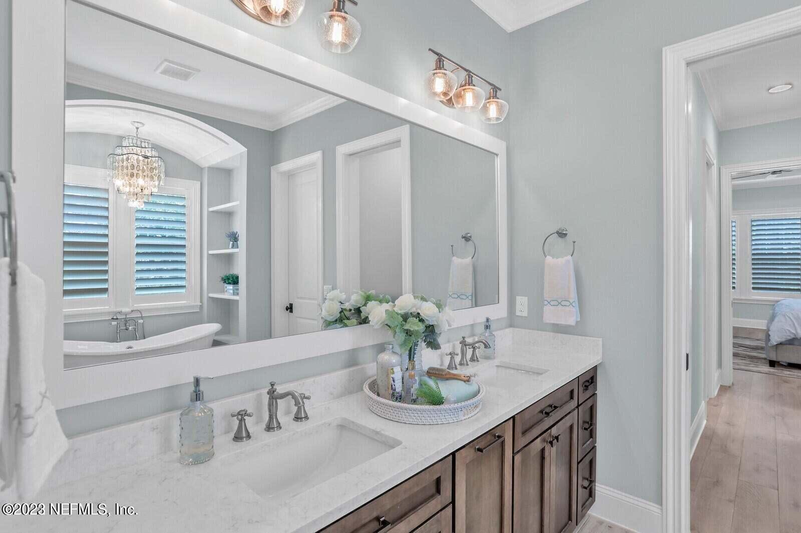 168 Hickory Hill Drive St. Augustine, FL 32095 - Photo 20 of 42 a bathroom with a sink and a mirror