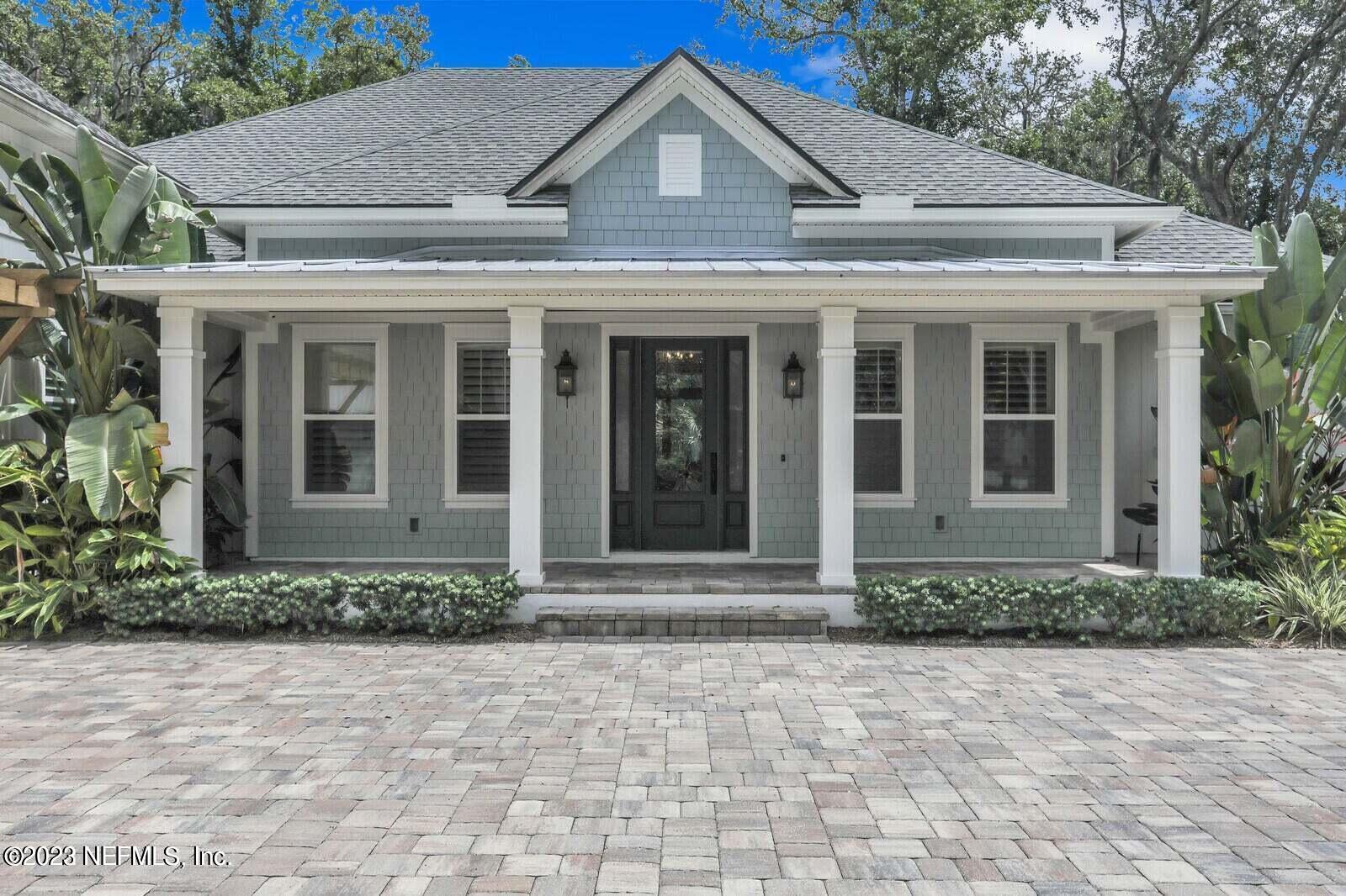 168 Hickory Hill Drive St. Augustine, FL 32095 - Photo 2 of 42 a view of brick house with large windows