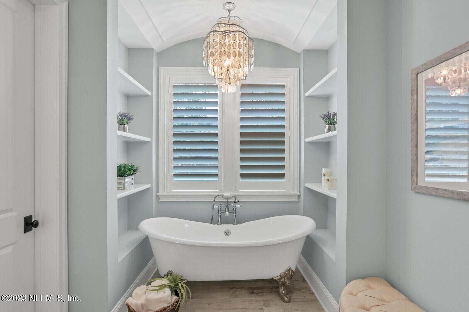 168 Hickory Hill Drive St. Augustine, FL 32095 - Photo 21 of 42 a bathroom with a sink a toilet and a window