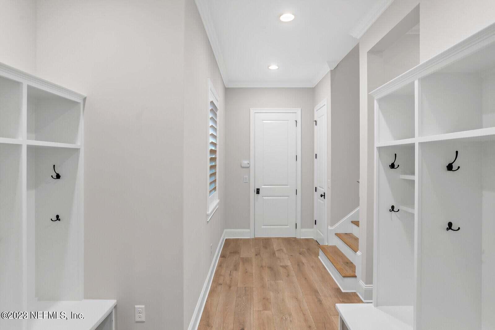 168 Hickory Hill Drive St. Augustine, FL 32095 - Photo 25 of 42 a view of a hallway with wooden floor and a bathroom