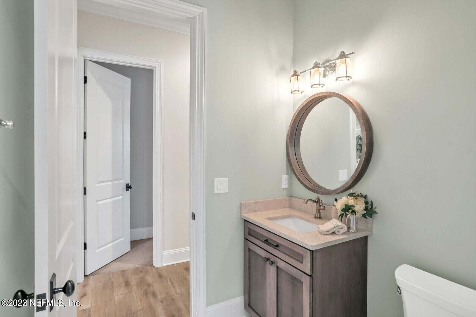 168 Hickory Hill Drive St. Augustine, FL 32095 - Photo 34 of 42 a bathroom with a sink and a mirror