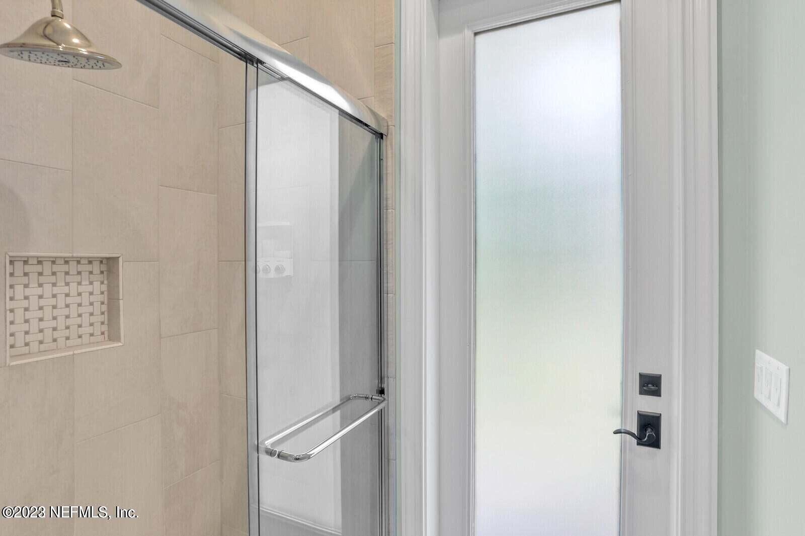 168 Hickory Hill Drive St. Augustine, FL 32095 - Photo 35 of 42 a bathroom with a glass shower door