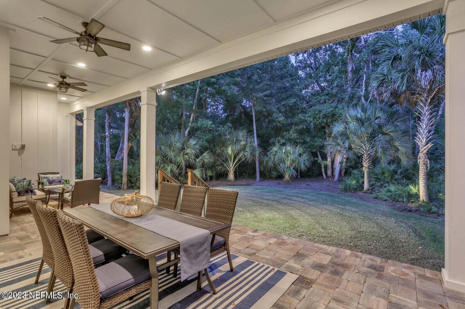 168 Hickory Hill Drive St. Augustine, FL 32095 - Photo 38 of 42 a view of a patio with a table and chairs