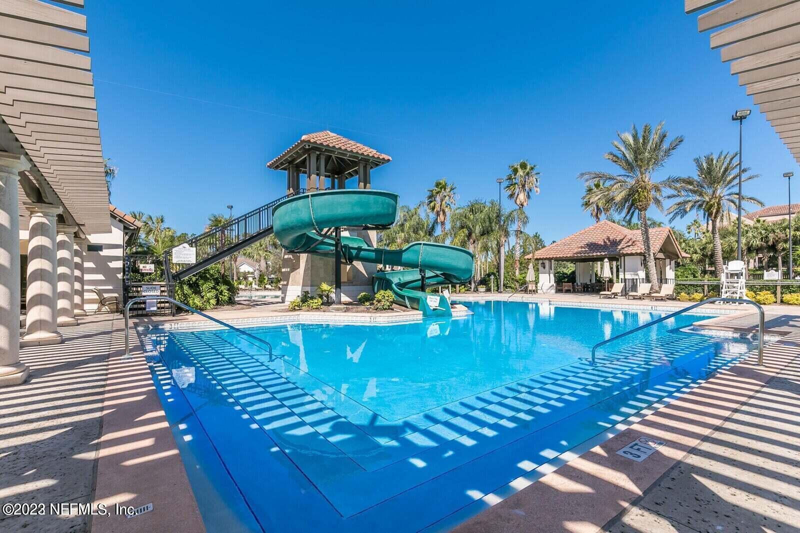 168 Hickory Hill Drive St. Augustine, FL 32095 - Photo 40 of 42 a view of a swimming pool with sitting area