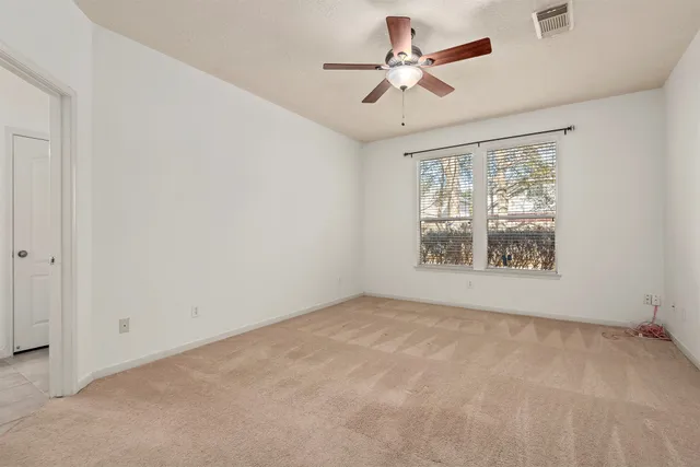 a bathroom with a bathtub a double vanity sink and a mirror