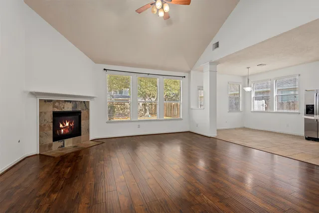a kitchen with stainless steel appliances granite countertop white cabinets sink and a granite counter top