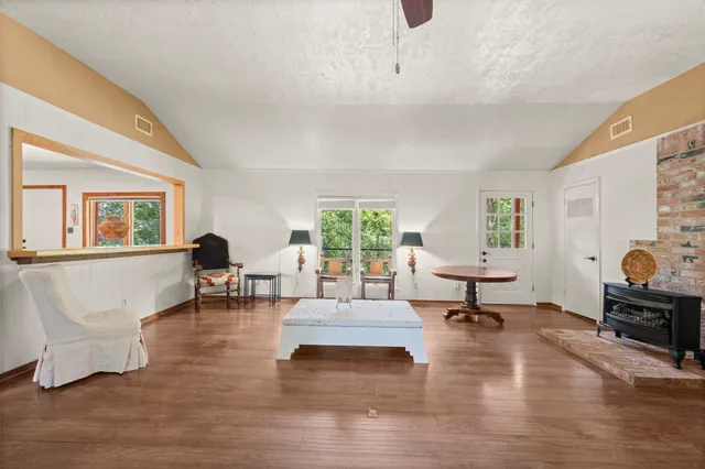 a living room with furniture and a fireplace