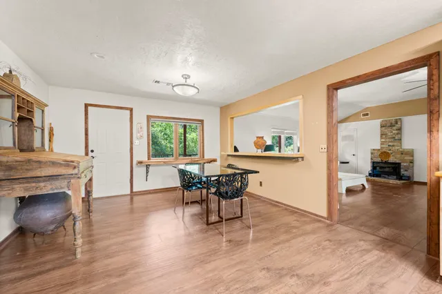 a view of a livingroom with furniture and a kitchen