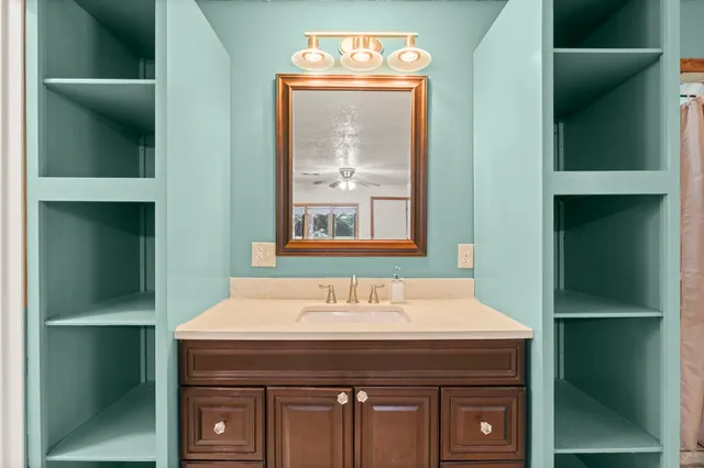 a bathroom with a sink and a mirror