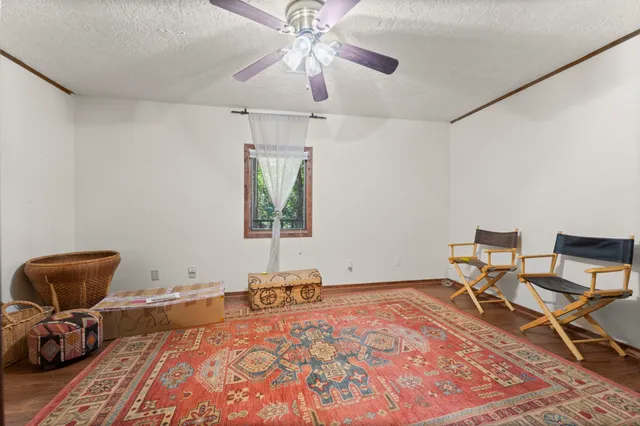 a bedroom with a bed and a chair