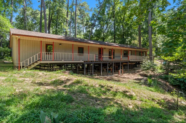 a backyard with wooden deck and backyard