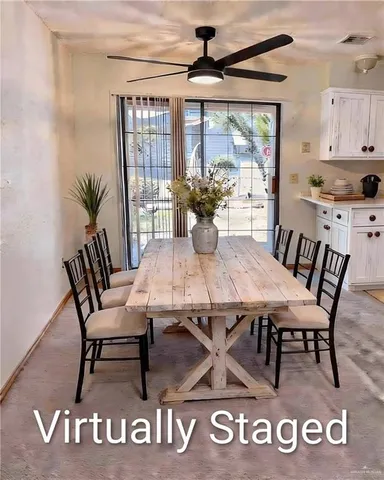 a view of a dining room with furniture window and outside view