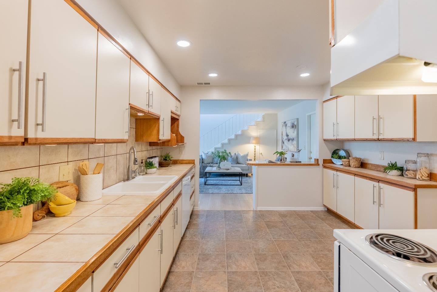 1069 East Homestead Road Sunnyvale, CA 94087 - Photo 13 of 36 a large kitchen with stainless steel appliances granite countertop a lot of counter space and a sink