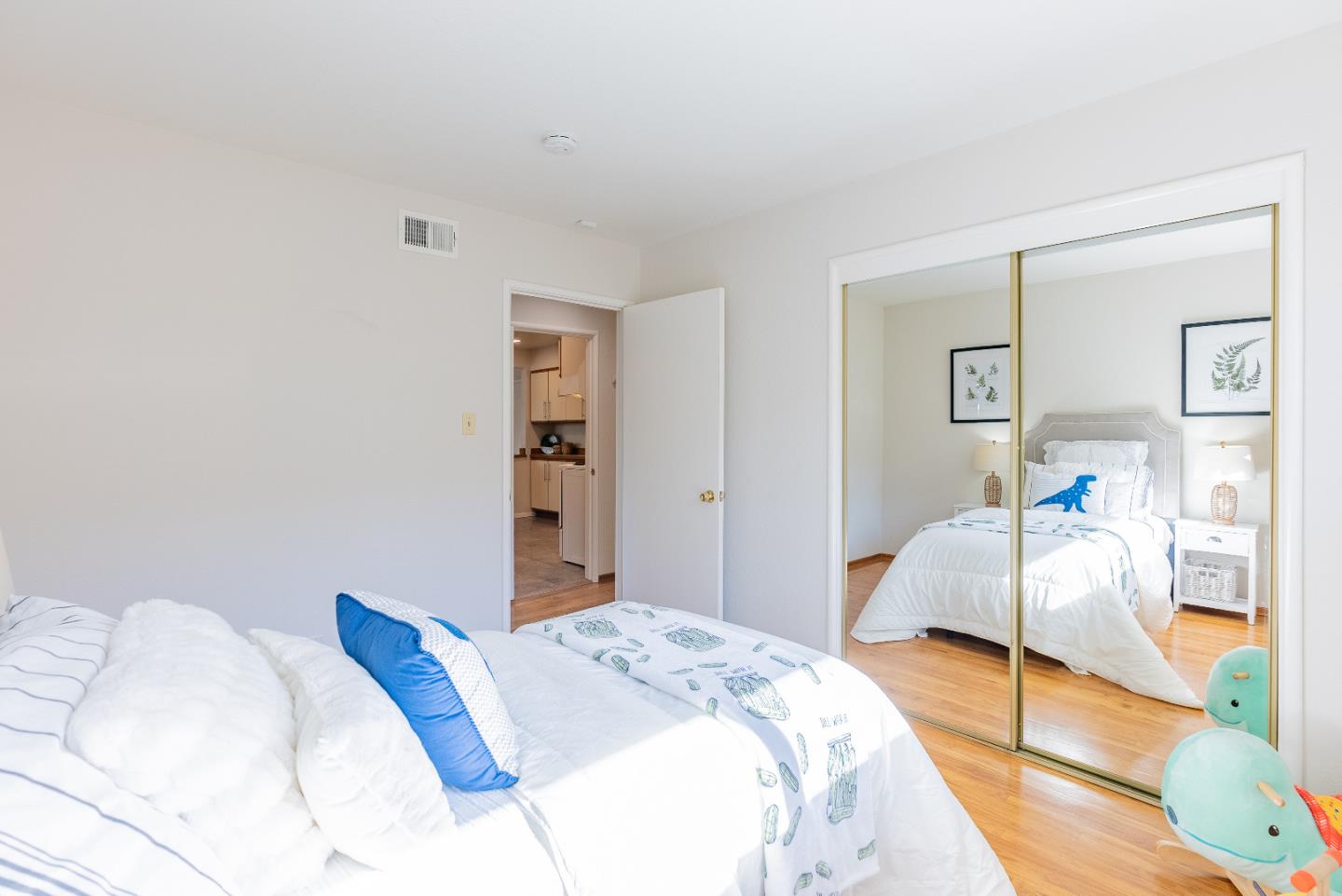 1069 East Homestead Road Sunnyvale, CA 94087 - Photo 19 of 36 a bedroom with a bed and lamp