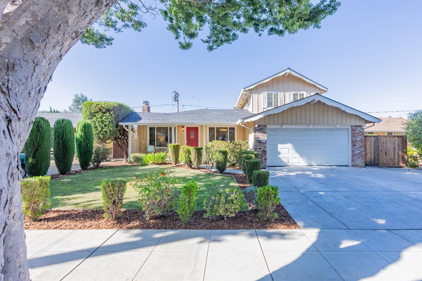 1069 East Homestead Road Sunnyvale, CA 94087 - Photo 2 of 36 a front view of a house with garden