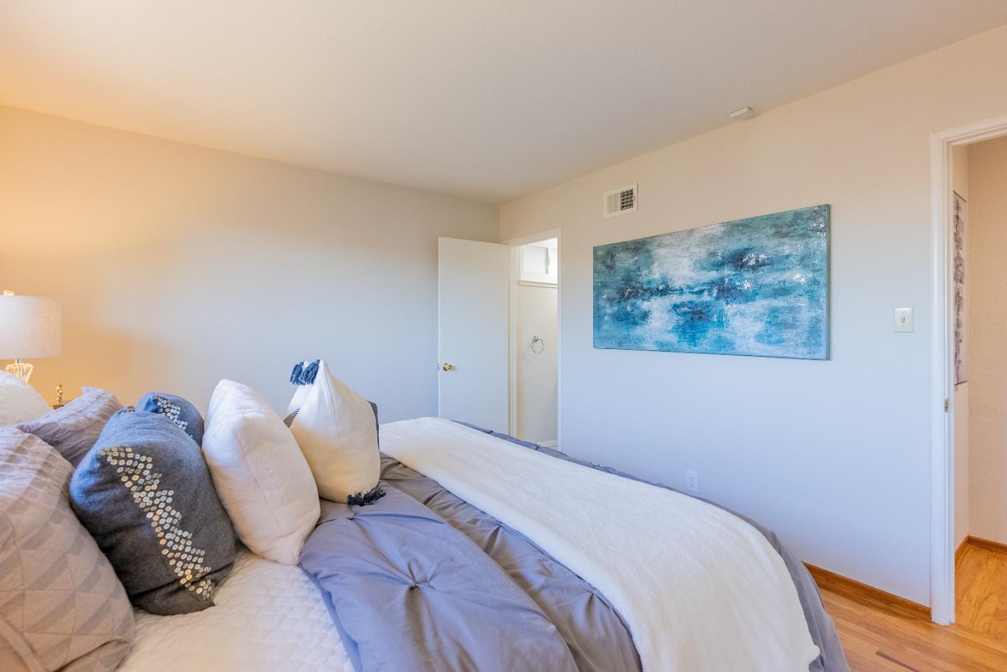 1069 East Homestead Road Sunnyvale, CA 94087 - Photo 25 of 36 a bedroom with a bed and a painting on the wall