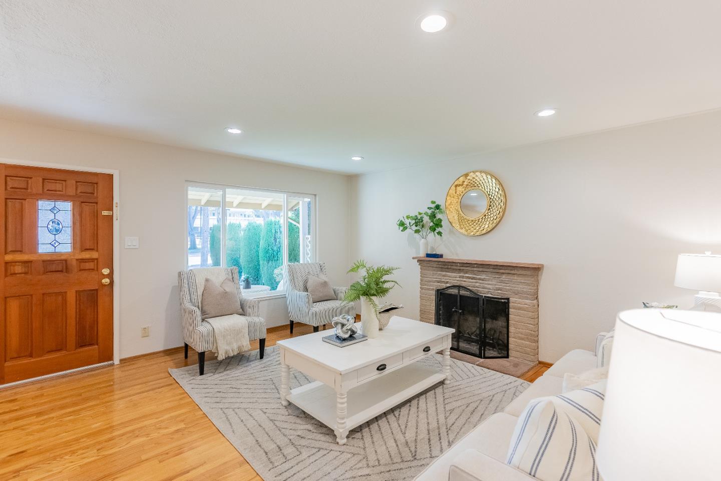 1069 East Homestead Road Sunnyvale, CA 94087 - Photo 8 of 36 a living room with furniture and a fireplace