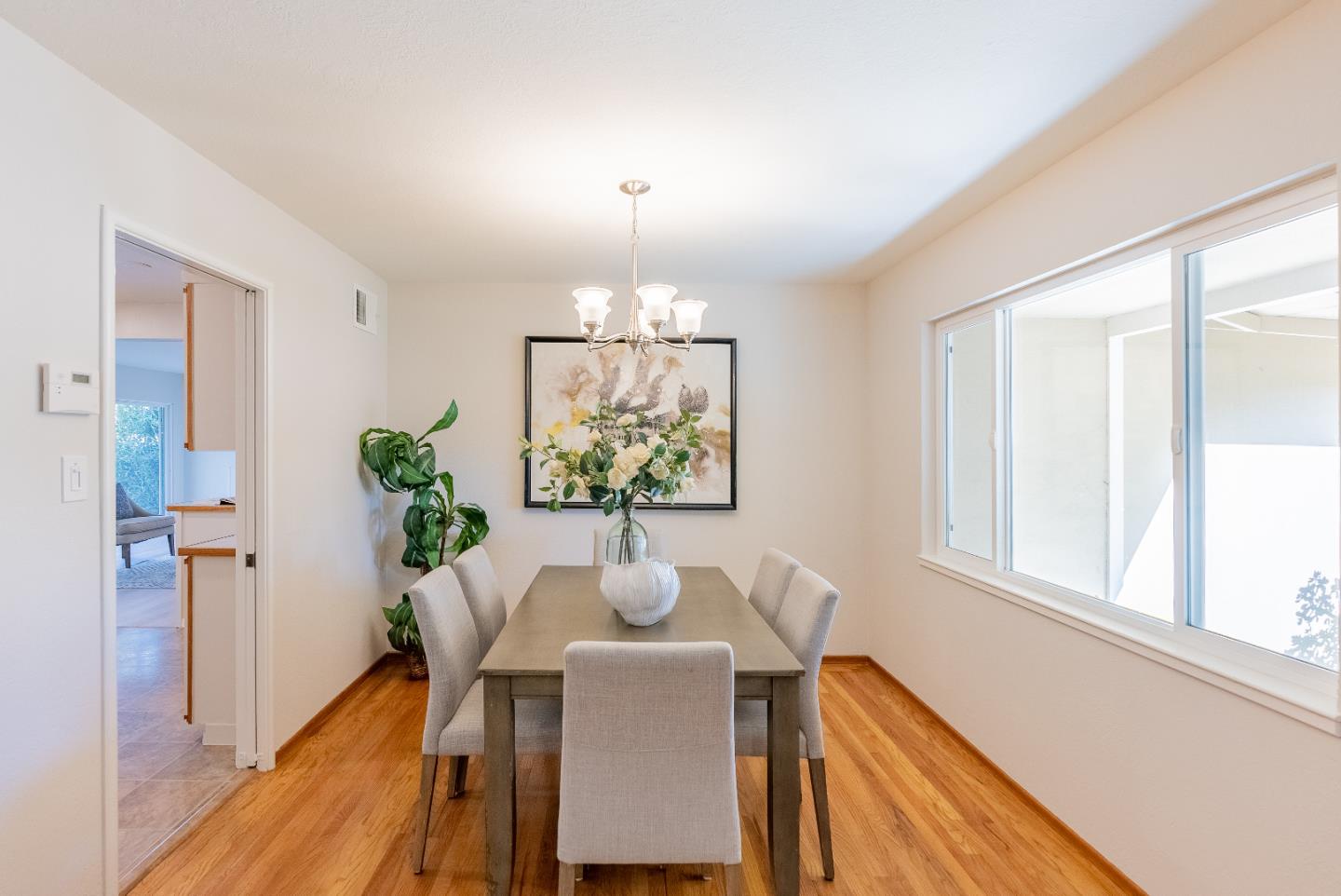 1069 East Homestead Road Sunnyvale, CA 94087 - Photo 9 of 36 a view of a dining room with furniture window and wooden floor