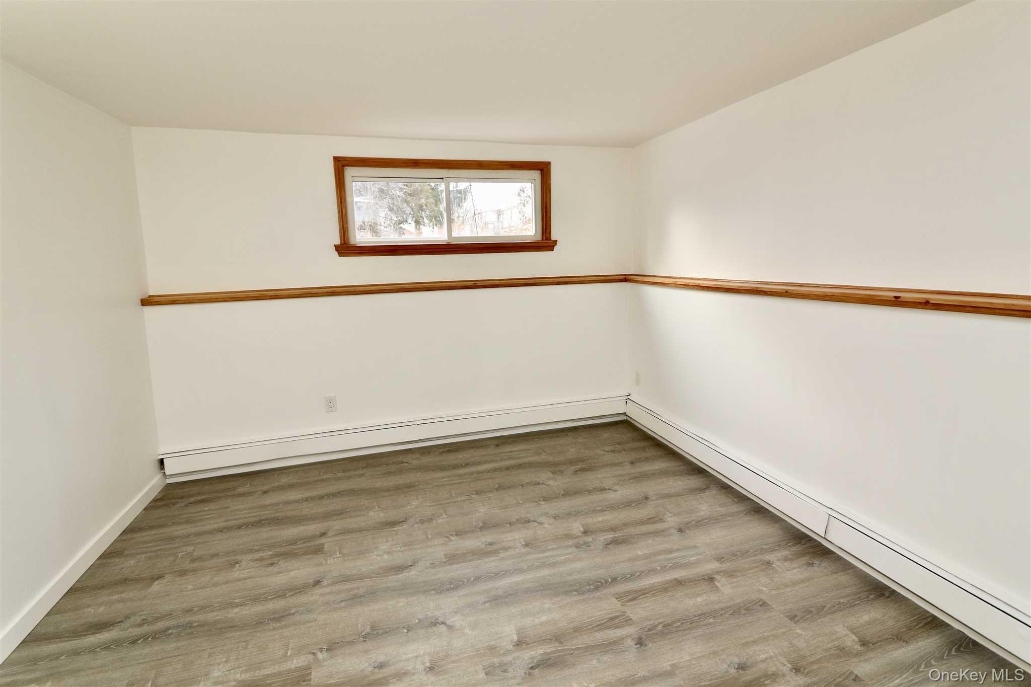 128 Catherine Street, Unit A Beacon, NY 12508 - Photo 12 of 18 an empty room with a window
