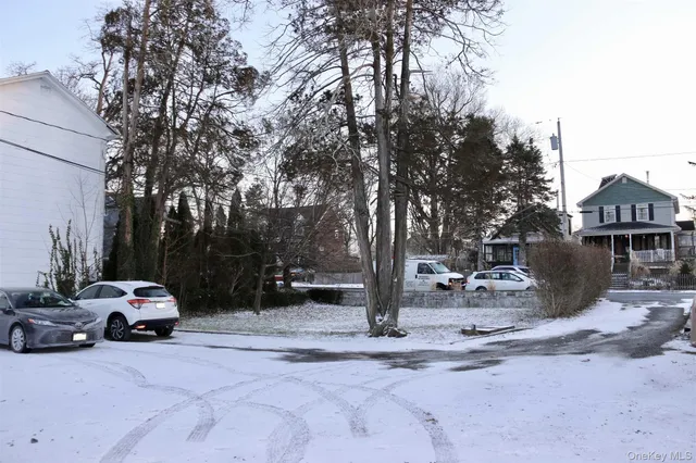 a view of a car park in front of house