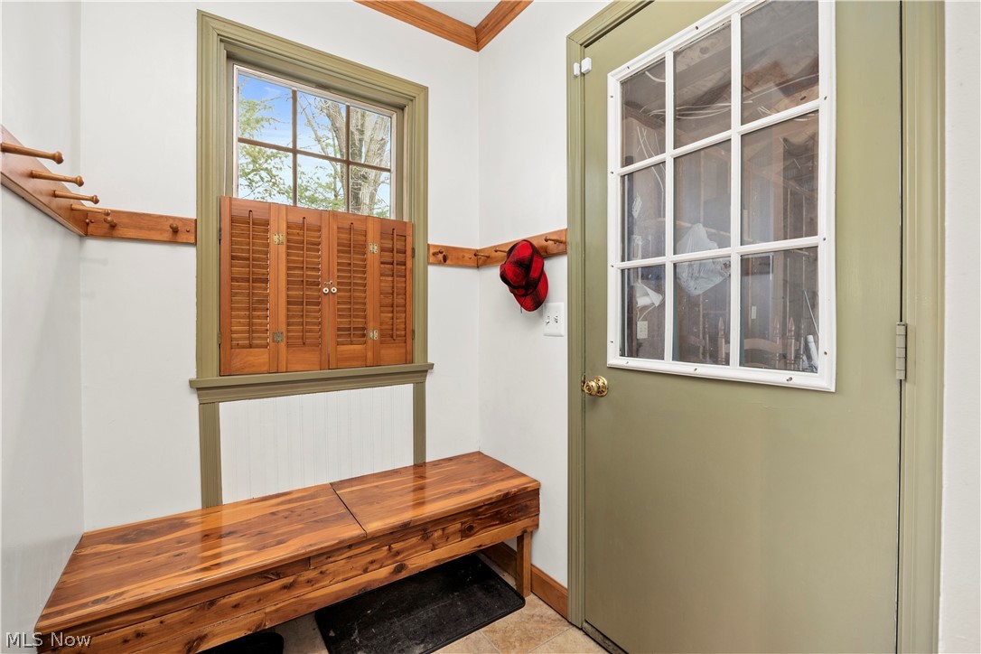 11923 Green Road Wakeman, OH 44889 - Photo 27 of 45 Mudroom featuring crown molding and light tile patterned floors