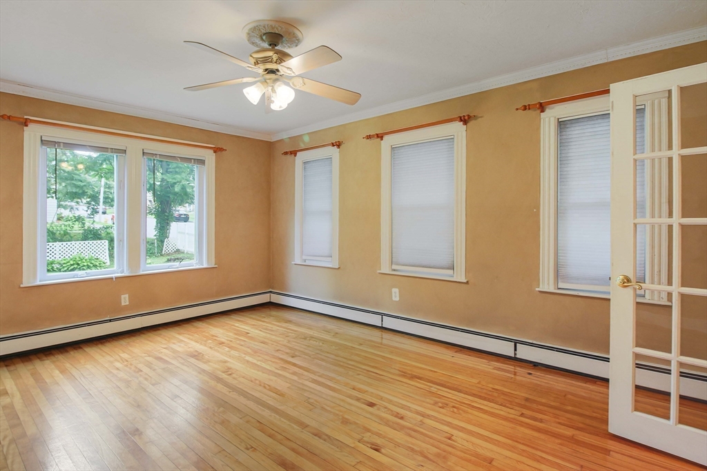 13 Superior Road Worcester, MA 01604 - Photo 20 of 40 a view of an empty room with a window and wooden floor